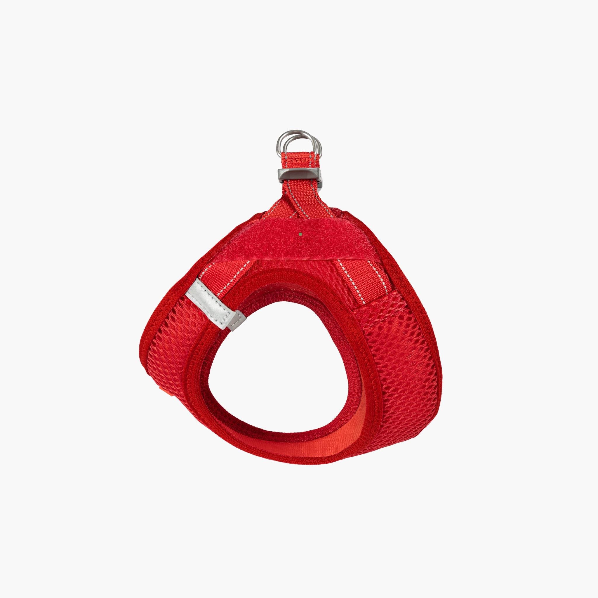 Front view of a red EzyDog harness with adjustable straps and a metal ring for leash attachment.