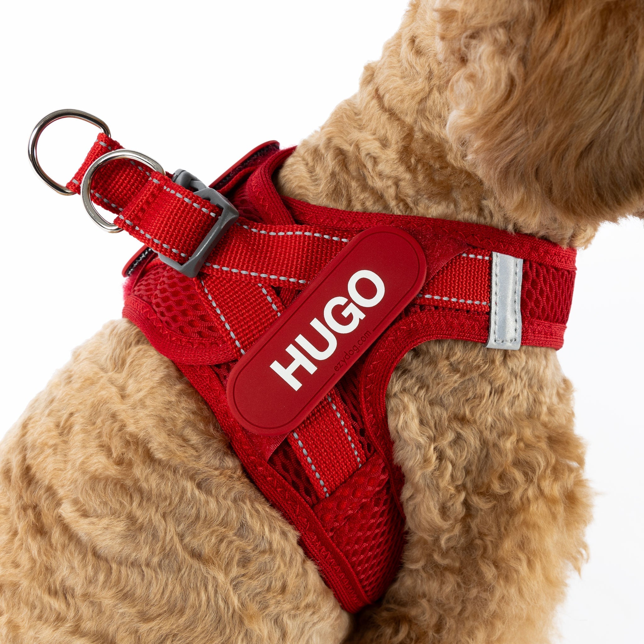 closeup view of red FormFit mesh harness with the name HUGO